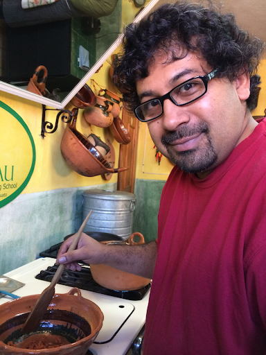 Photo of Sayan cooking.